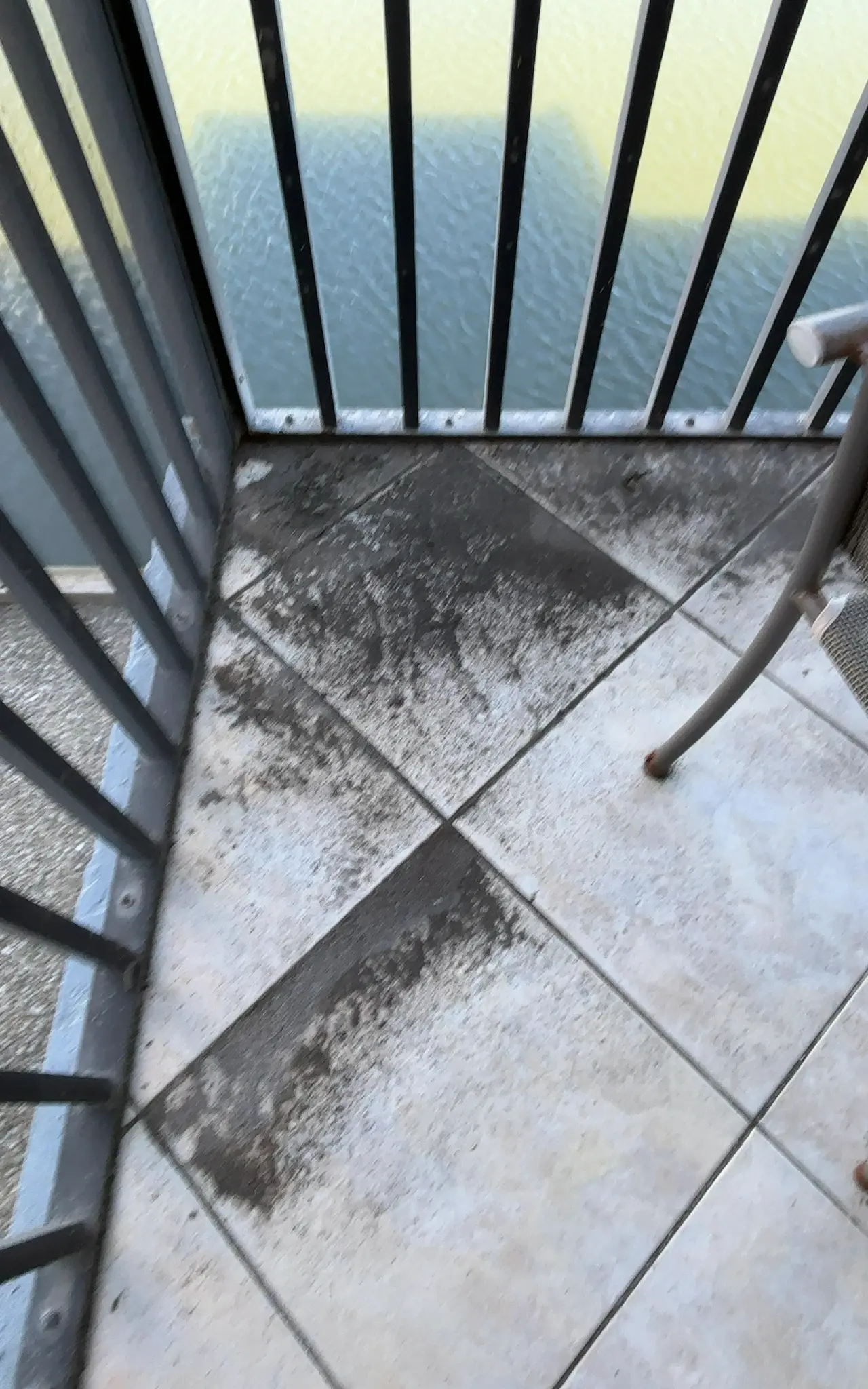 Balcony tile before professional deep clean