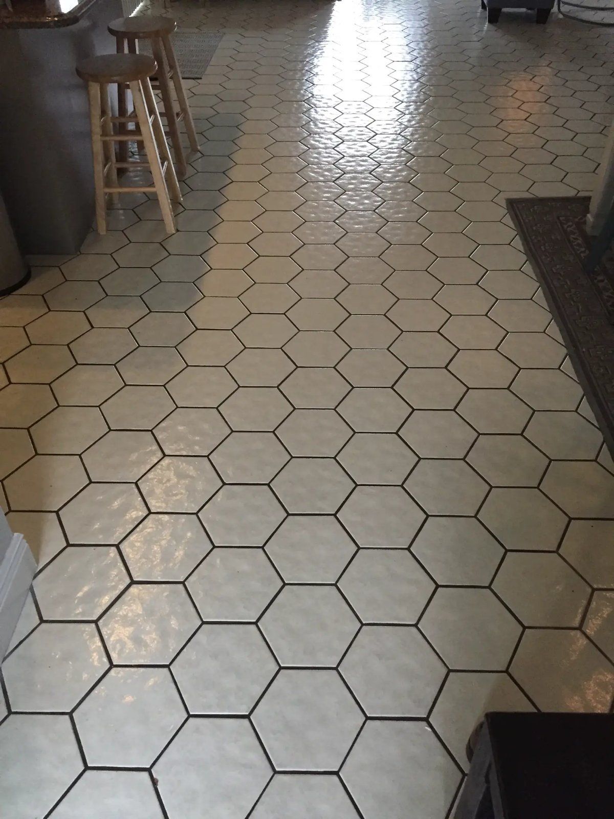 Octagon tile before cleaning — dark, stained grout